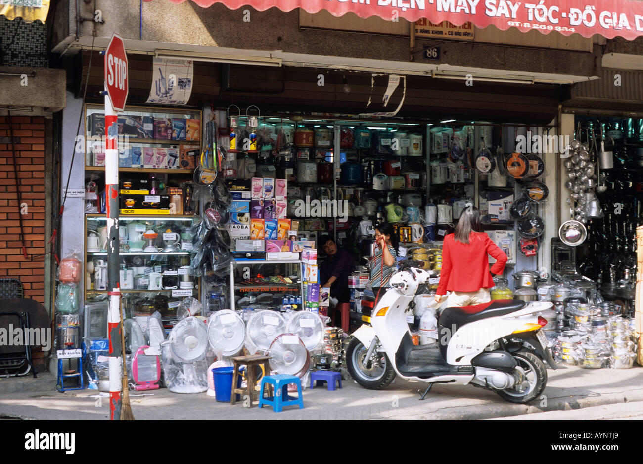 A scooter parked outside an electrical appliance shop in Old Hanoi Stock  Photo - Alamy