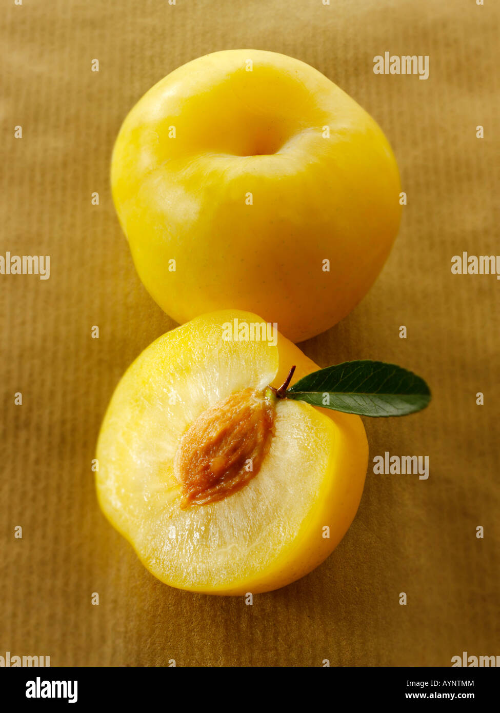 Fresh Yellow Organic plum - cut and whole Stock Photo