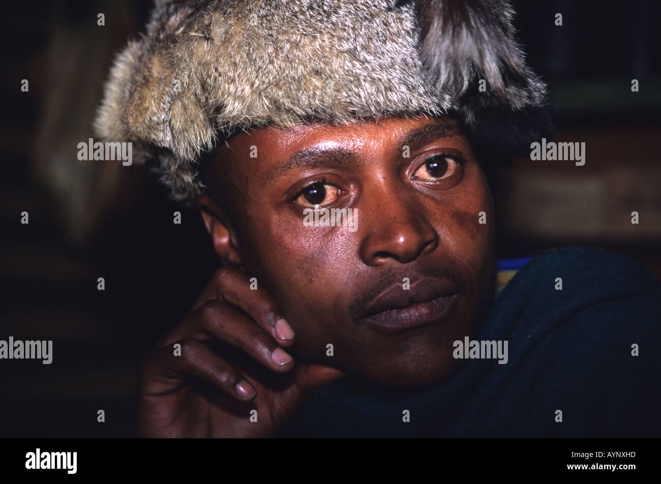 Portrait of a 'sangoma' or traditional healer in fur hat, Maputsoe, Lesotho, Southern Africa Stock Photo