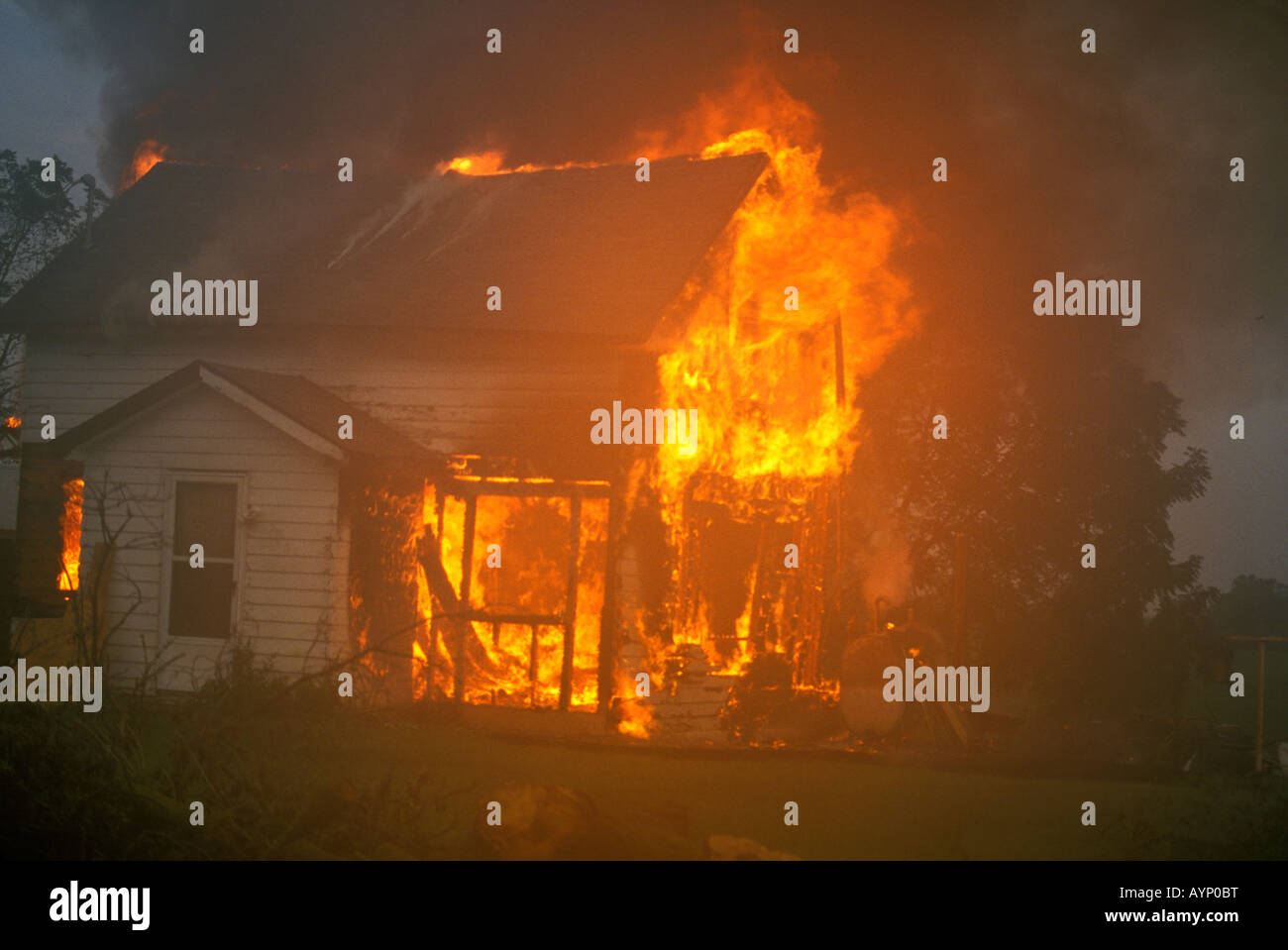 Vacant house on fire USA, by Carol Dembinsky/Dembinsky Photo Assoc Stock Photo