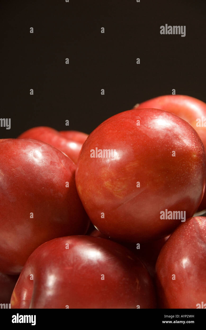 red plums on black background Stock Photo Alamy