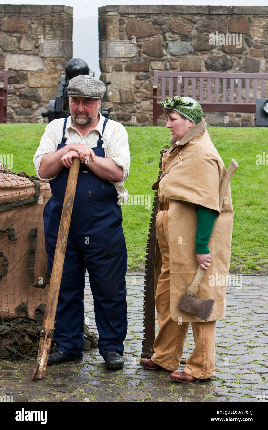 Man and women dressed as farm workers during 1940s WW2 reenactment Stock Photo
