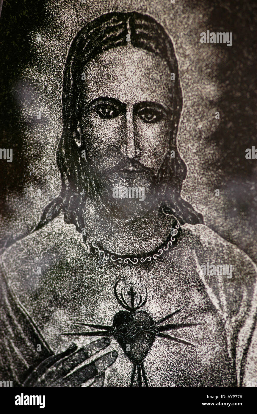 Jesus Christ with heart stone bass relief Stock Photo
