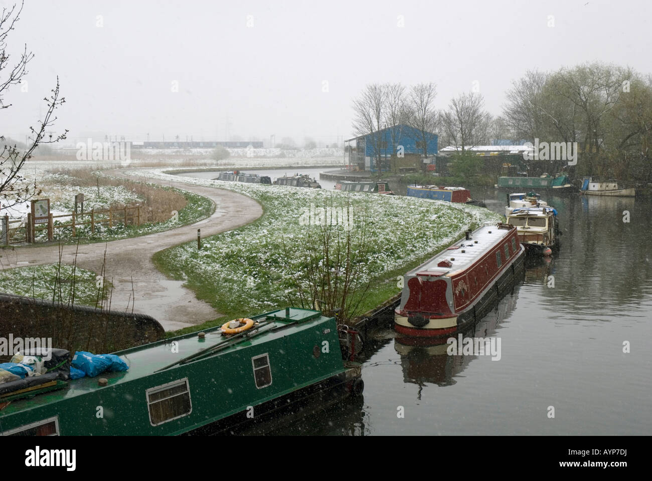 Houseboats in the snow on the river Lea at Walthamstow marshes Lee