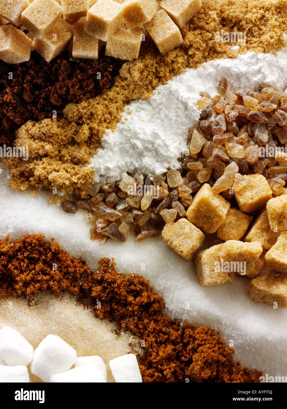 Raw sugar - from top - a mixture of raw granules and sugar cubes Stock Photo