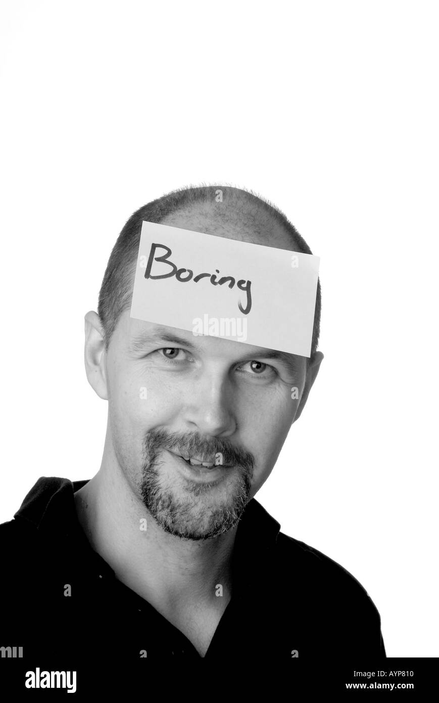 man with post it note on his head indicating that he is board boring not interested disinterested Stock Photo