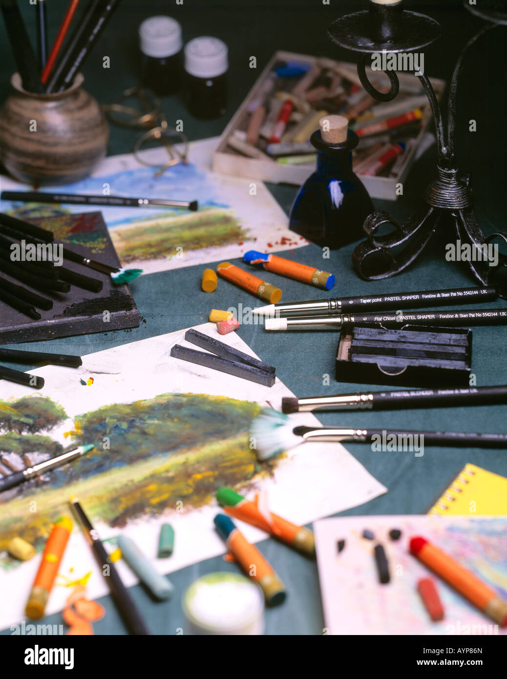 A photograph of pictures being painted in an artists studio Stock Photo