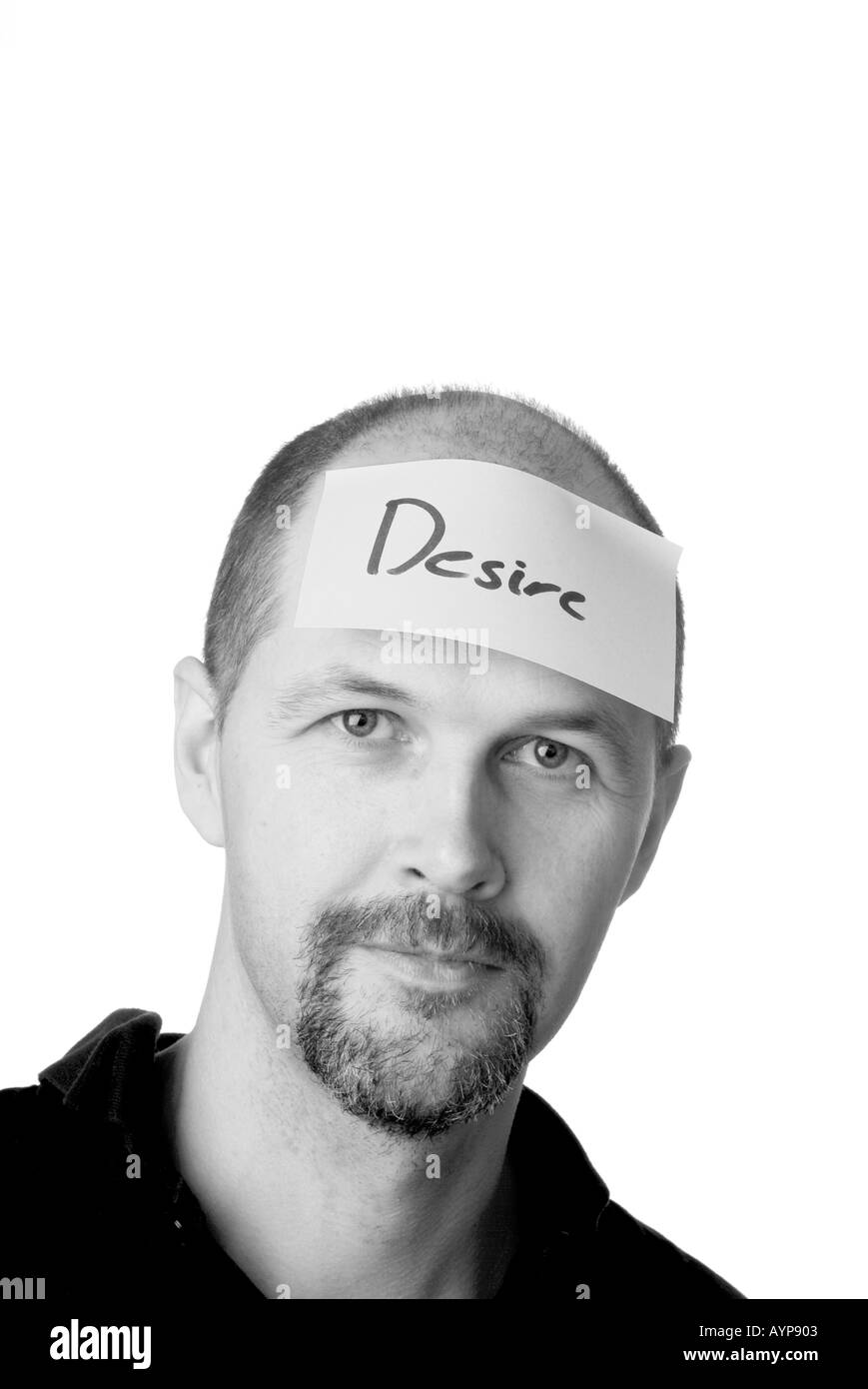 man with post it note on head thinking about desire want have dream aspire aspriational Stock Photo