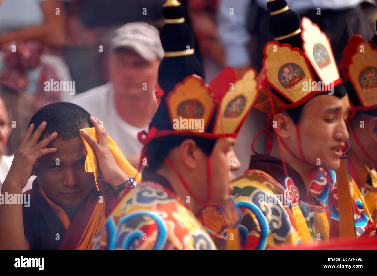 Tibetan Buddhist monks in traditional ceremonial hats and robes during ...