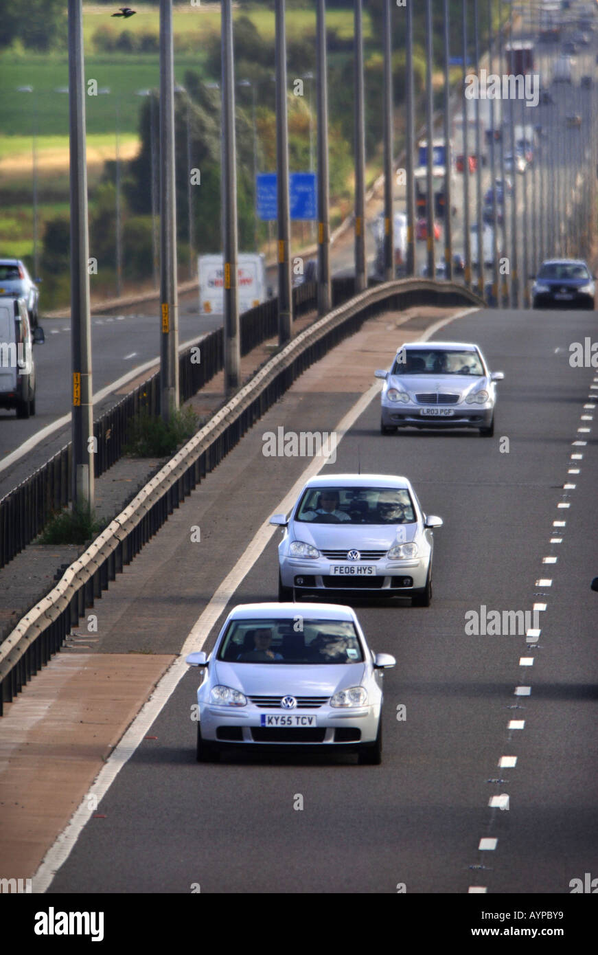 THREE SILVER CARS ON THE M5 NEAR THE M50 JUNCTION IN WORCESTERSHIRE UK SEP 2006 Stock Photo
