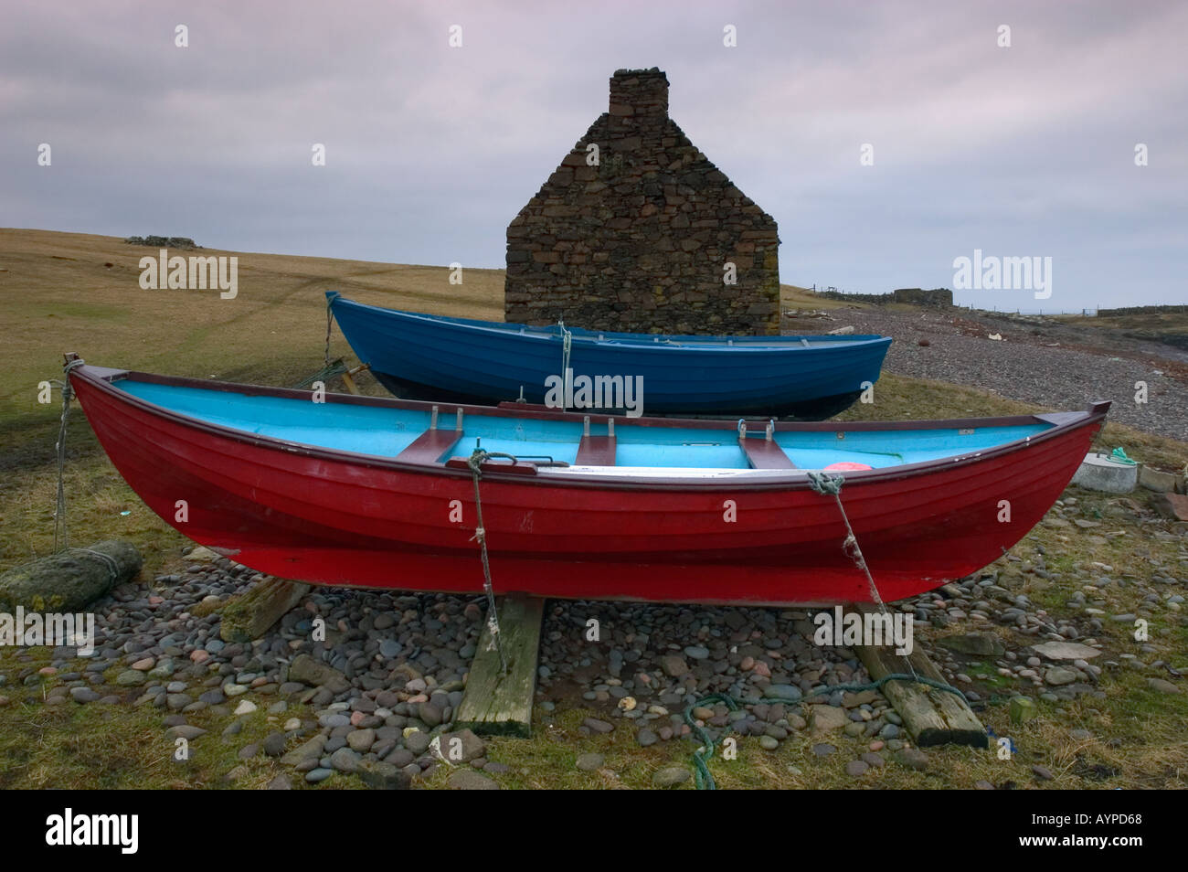 SHETLAND ISLANDS, Scotland, UK Traditional boats and croft house,  WINTER Stock Photo