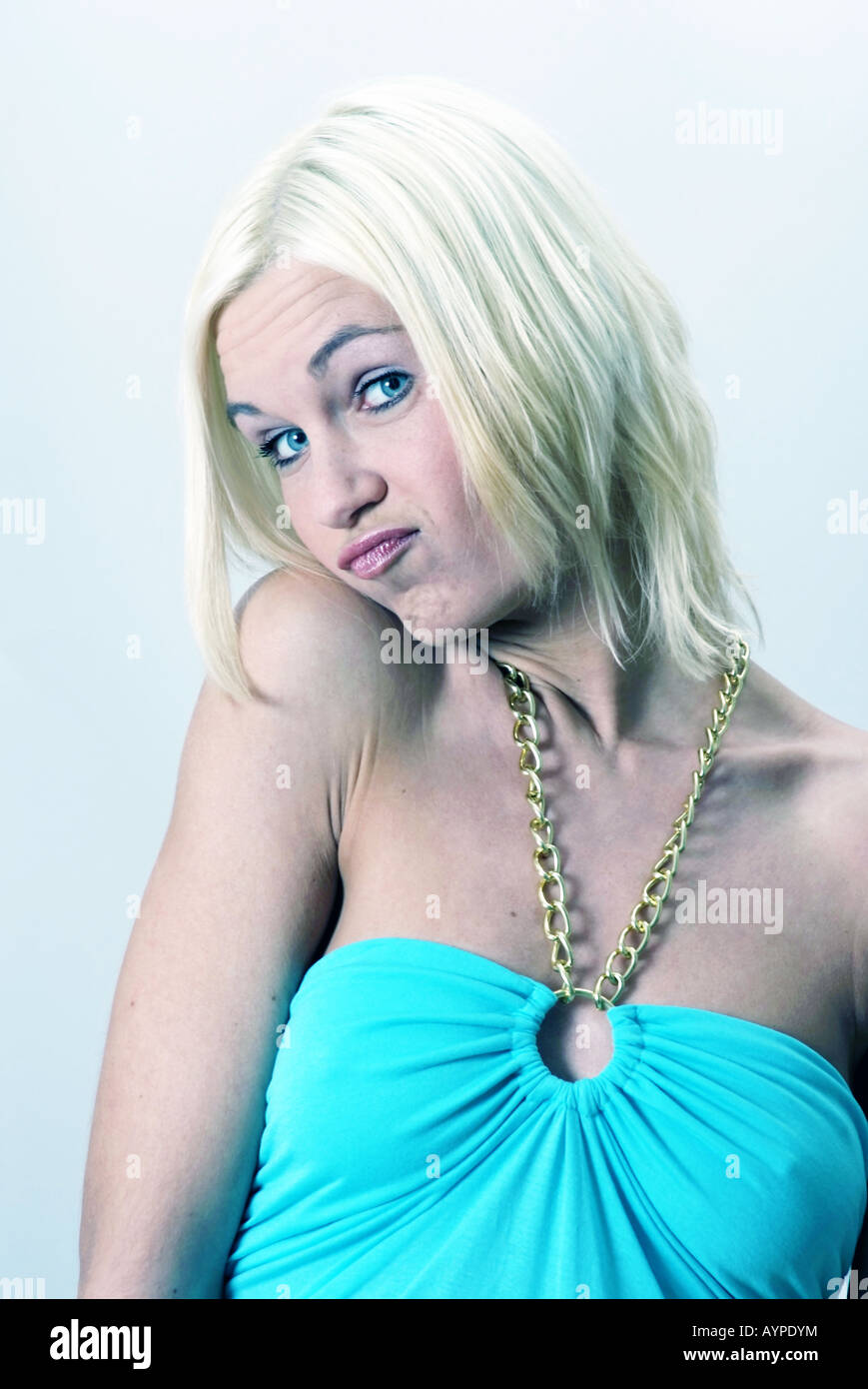 Blond beautiful Woman looking funny | Blonde junge Frau macht eine Grimasse Stock Photo