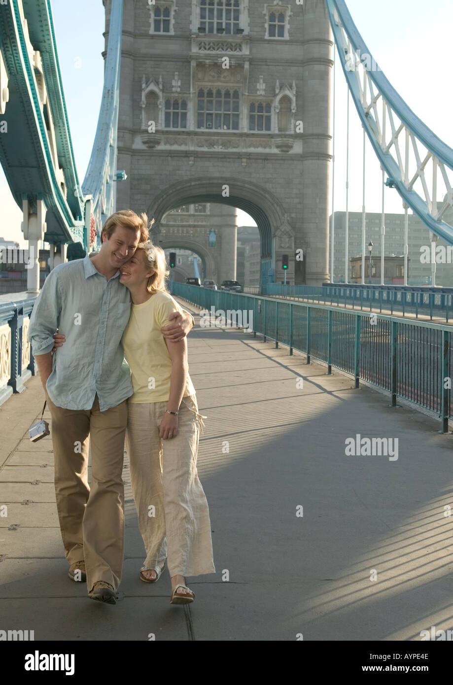 couple strolling over tower bridge Stock Photo