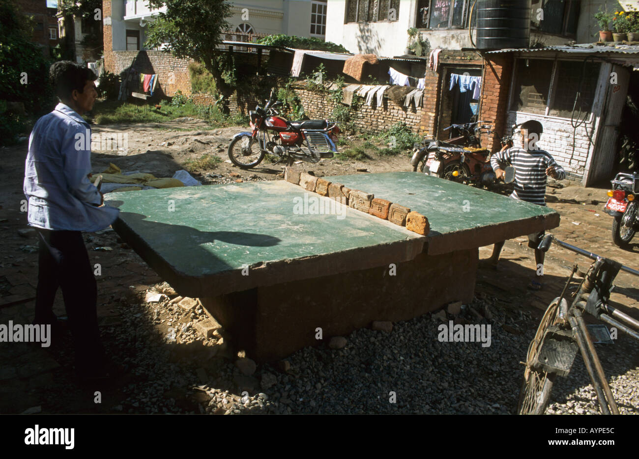 Two Nepali boys playing Table Tennis in Kathmandu Valley Nepal Stock