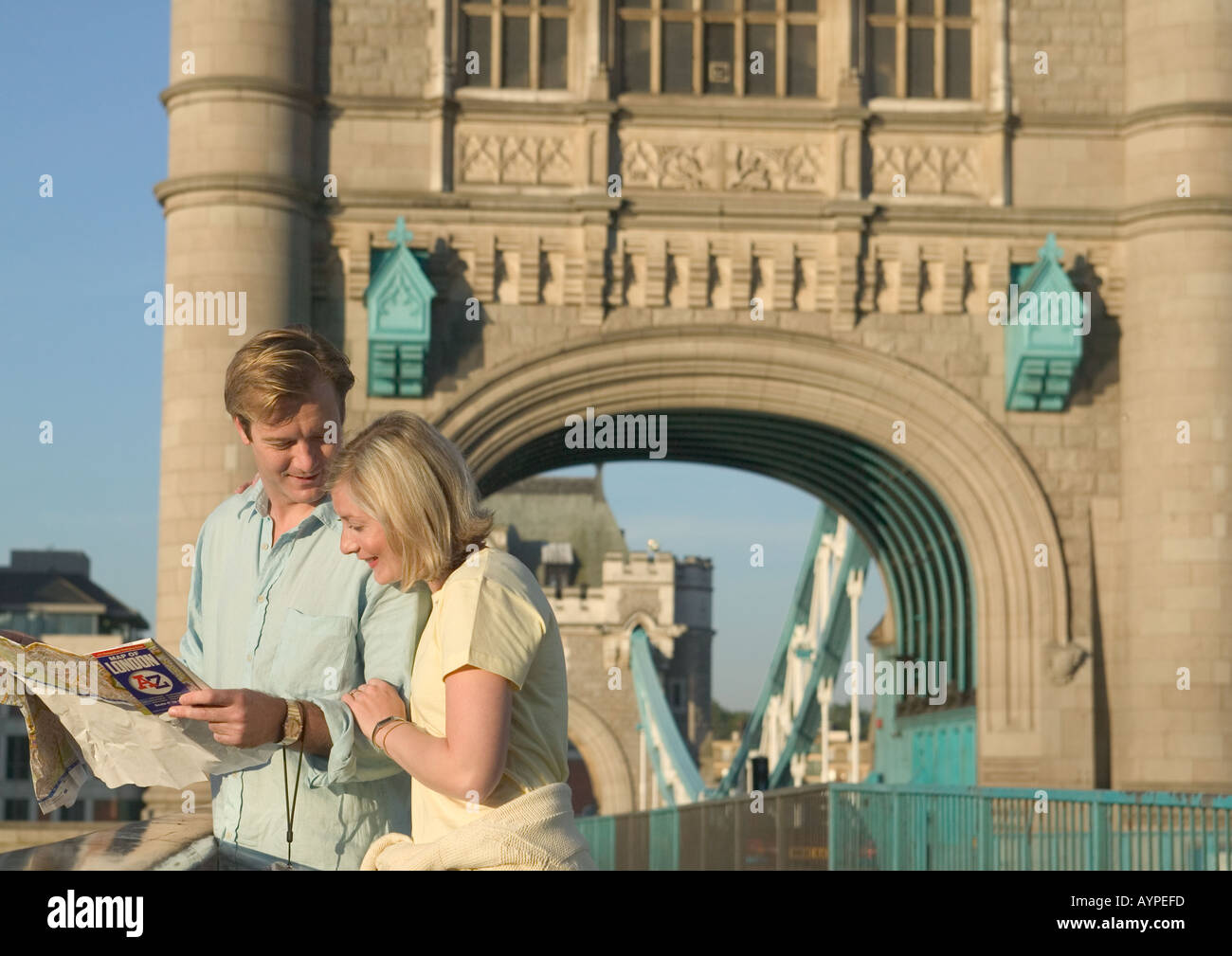 young couple standing on tower bridge in london Stock Photo
