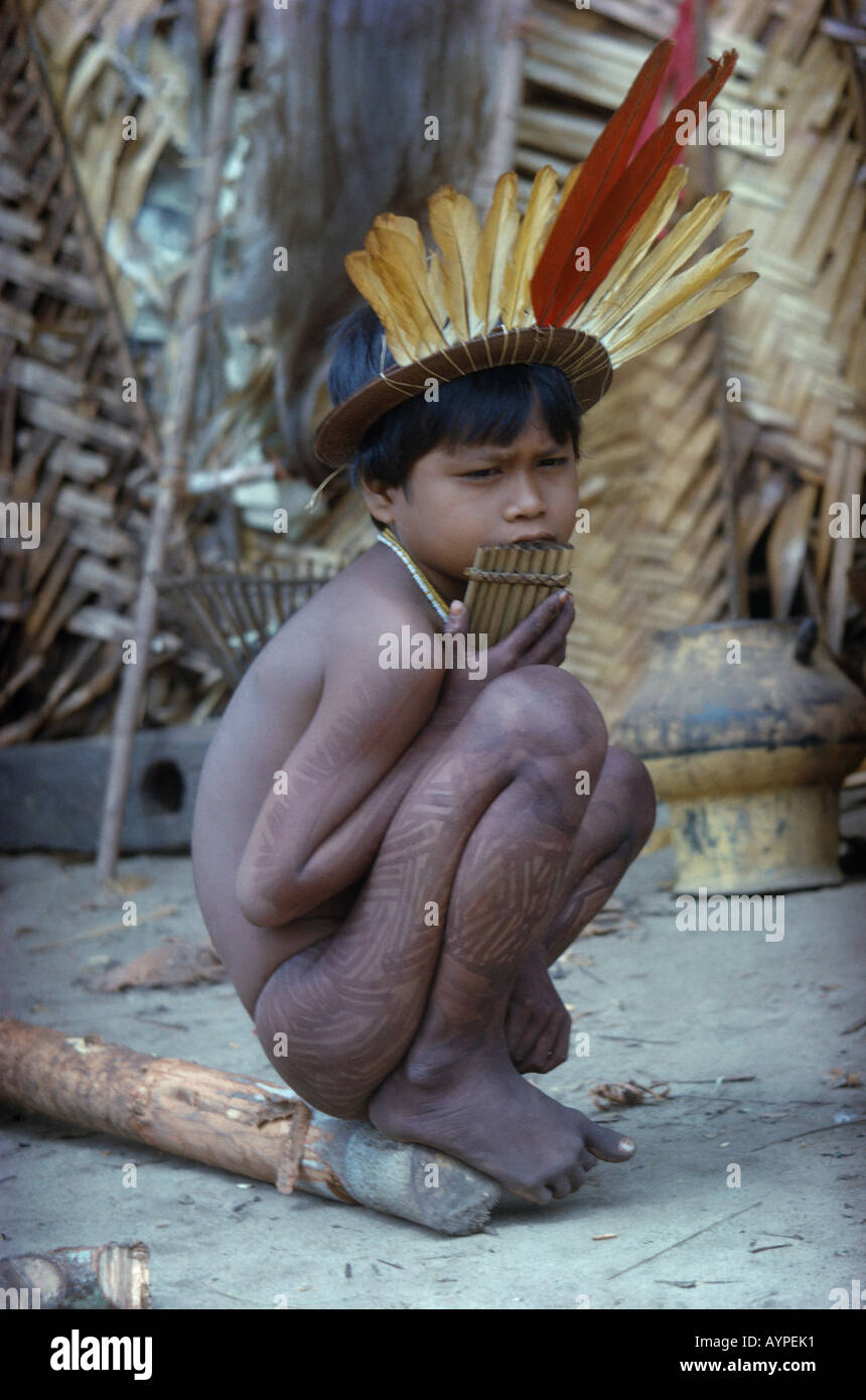 COLOMBIA South America Vaupes Region Amazon Jungle Amazonia Turkano Tribe Young boy with tattooed legs and feather headdress Stock Photo