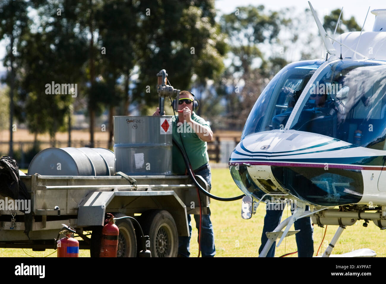 Refuelling the Bell 206B3 Jetranger helicopter from fuel drums using a