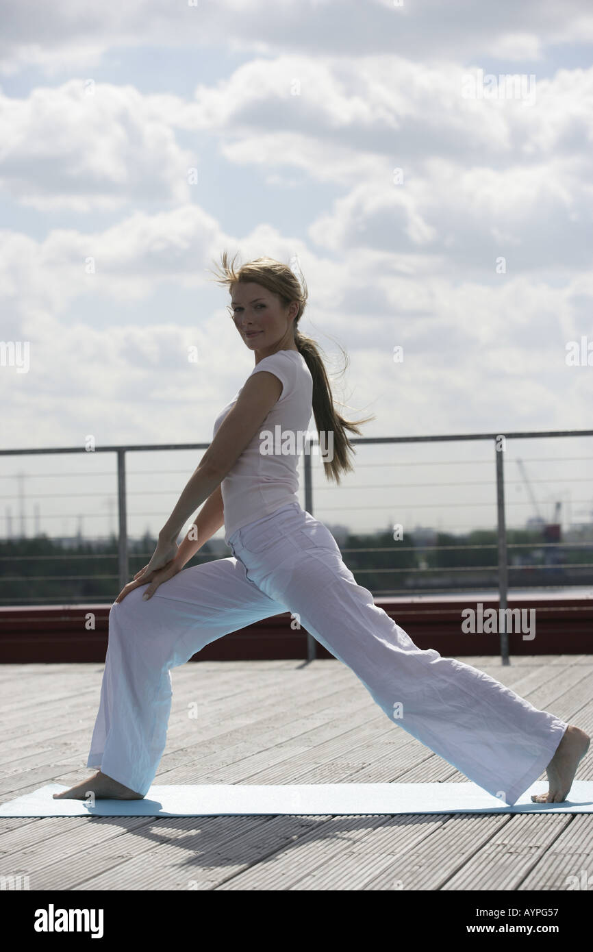 A blonde woman exercising Stock Photo