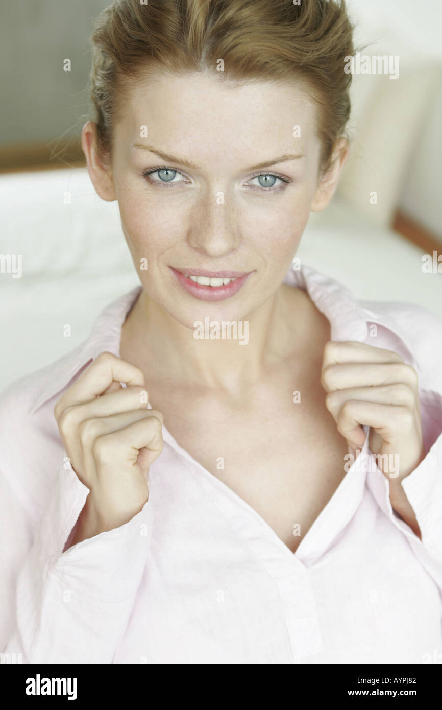 A blonde woman smiles as she looks at the camera Stock Photo - Alamy