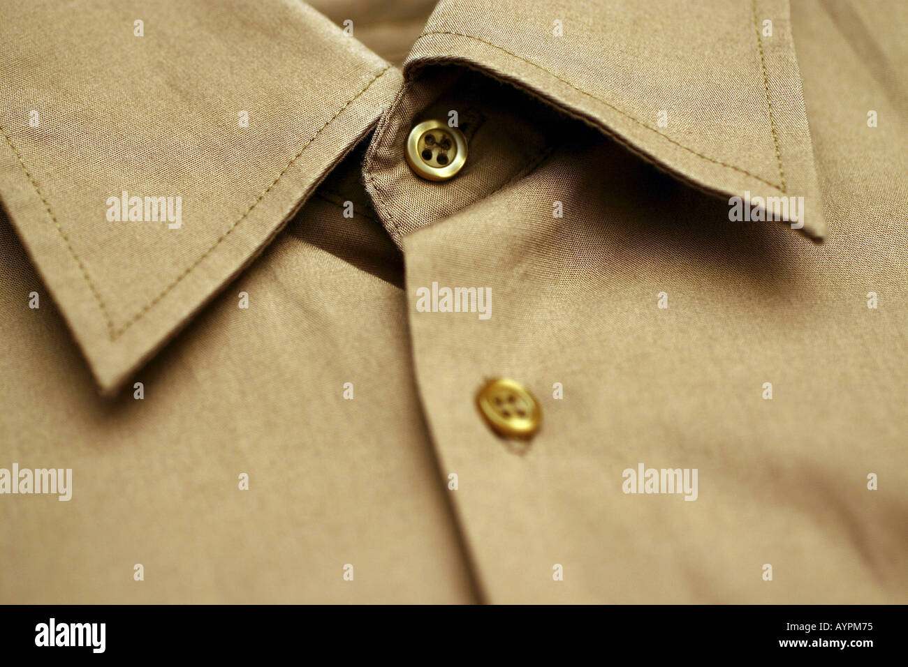 A close up of a beige colored shirt Stock Photo
