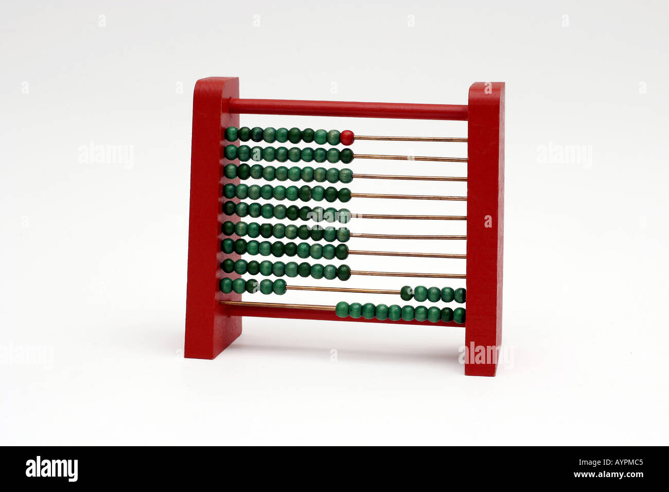 An abacus is placed on the white table with small counter balls pierced in the rods Stock Photo