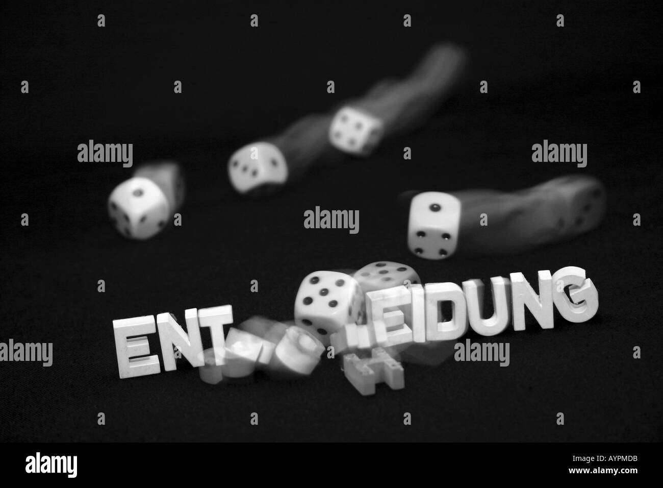 White dices thrown on the table with alphabets seen against them Stock Photo