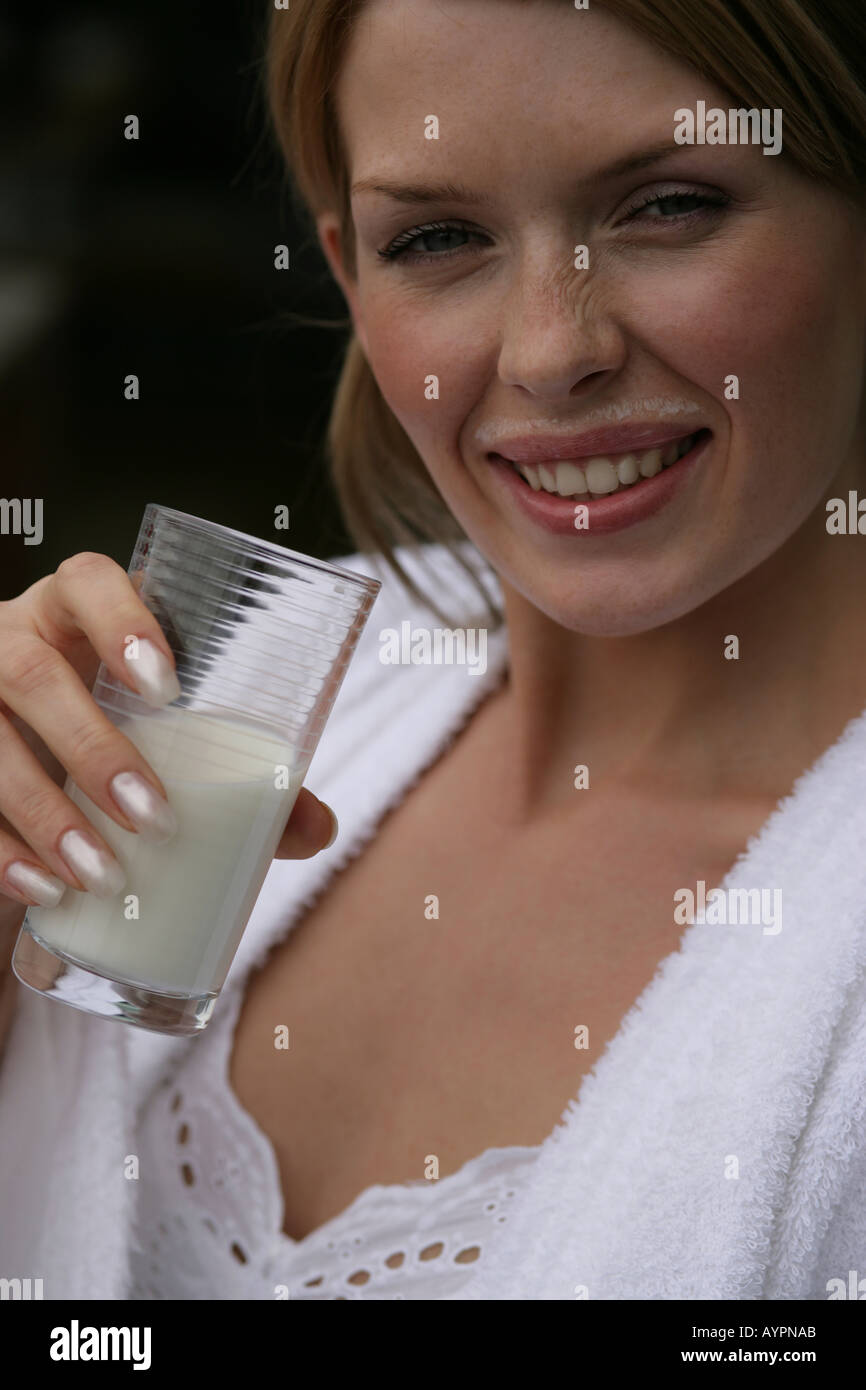Portrait of a woman with a glass of milk in her hand Stock Photo