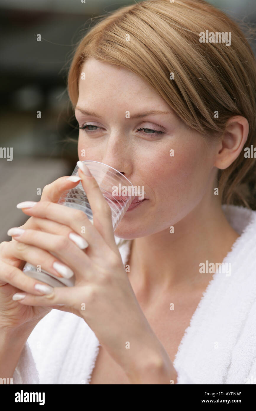 Portrait of a woman with a glass of milk in her hand Stock Photo