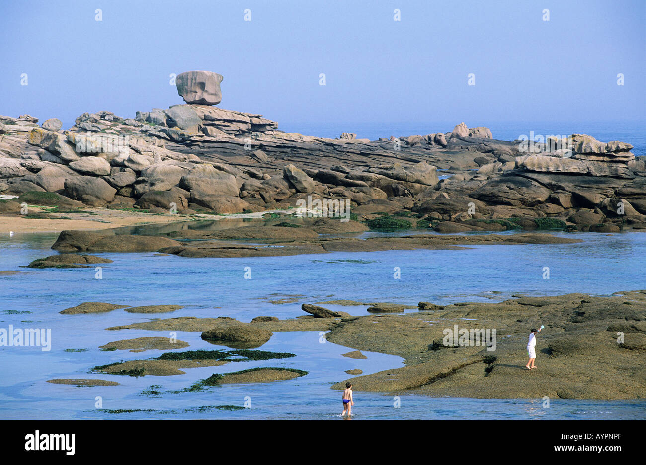 Rock formations of pink granite along the Cote granit Rosa coast at ...