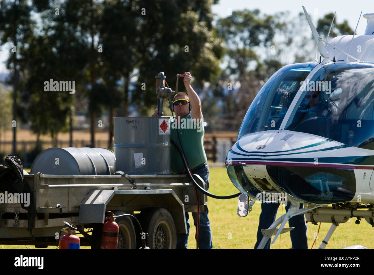 Refueling the Bell 206B3 Jetranger helicopter from fuel drums using a