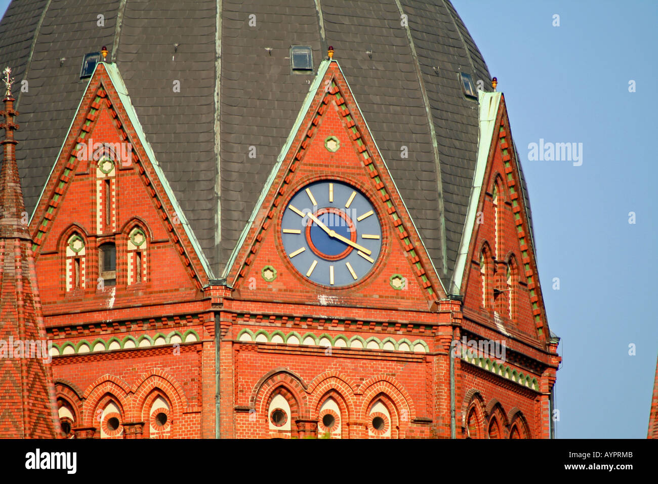 clock of red church berlin germany Stock Photo
