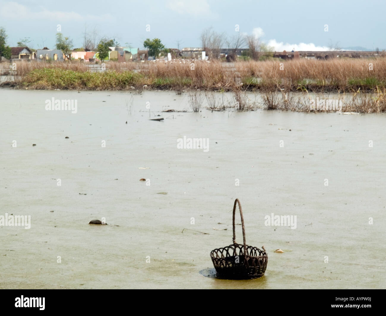 Lake of hot mud and water which is engulfing this small village at Sidoarjo,East Java,Indonesia. Stock Photo
