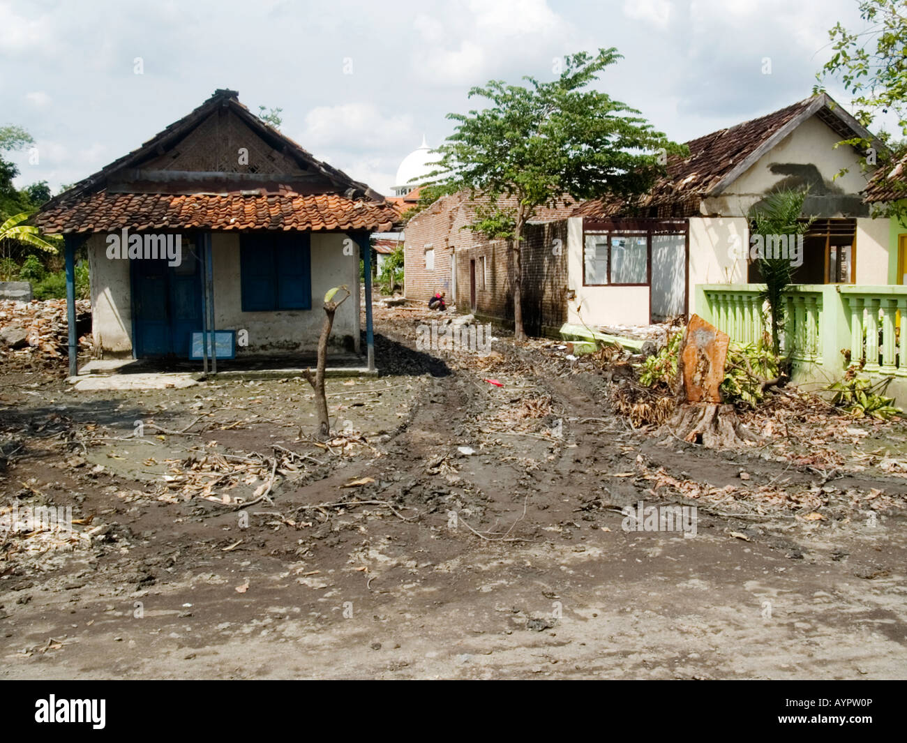 View of abandoned derelict house beside the approaching lake of hot mud and water,Sidoarjo,East Java,Indonesia. Stock Photo