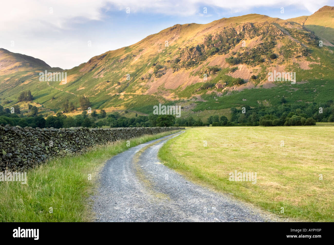 Winding road leading to Angletarn Pikes and Boredale Hause from Bridgend, near Ullswater in the Lake District National Park, UK Stock Photo