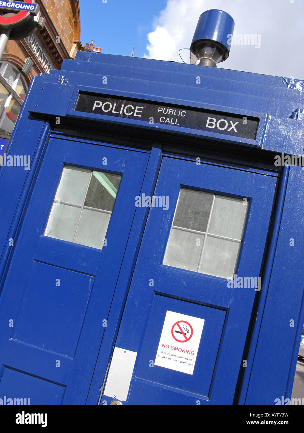 LONDON, UK. Old-fashioned blue police telephone box on the Earl's Court Road, with No Smoking sign on door. Stock Photo