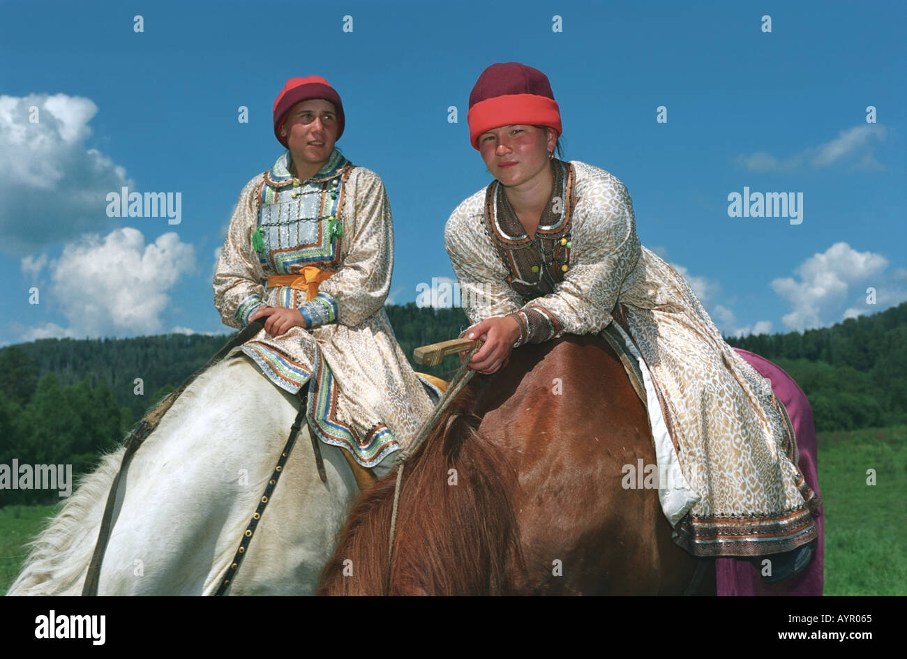 Horse riders in national Altaic costumes The ethnic festival El Oiyn Altai Siberia Russia Stock Photo