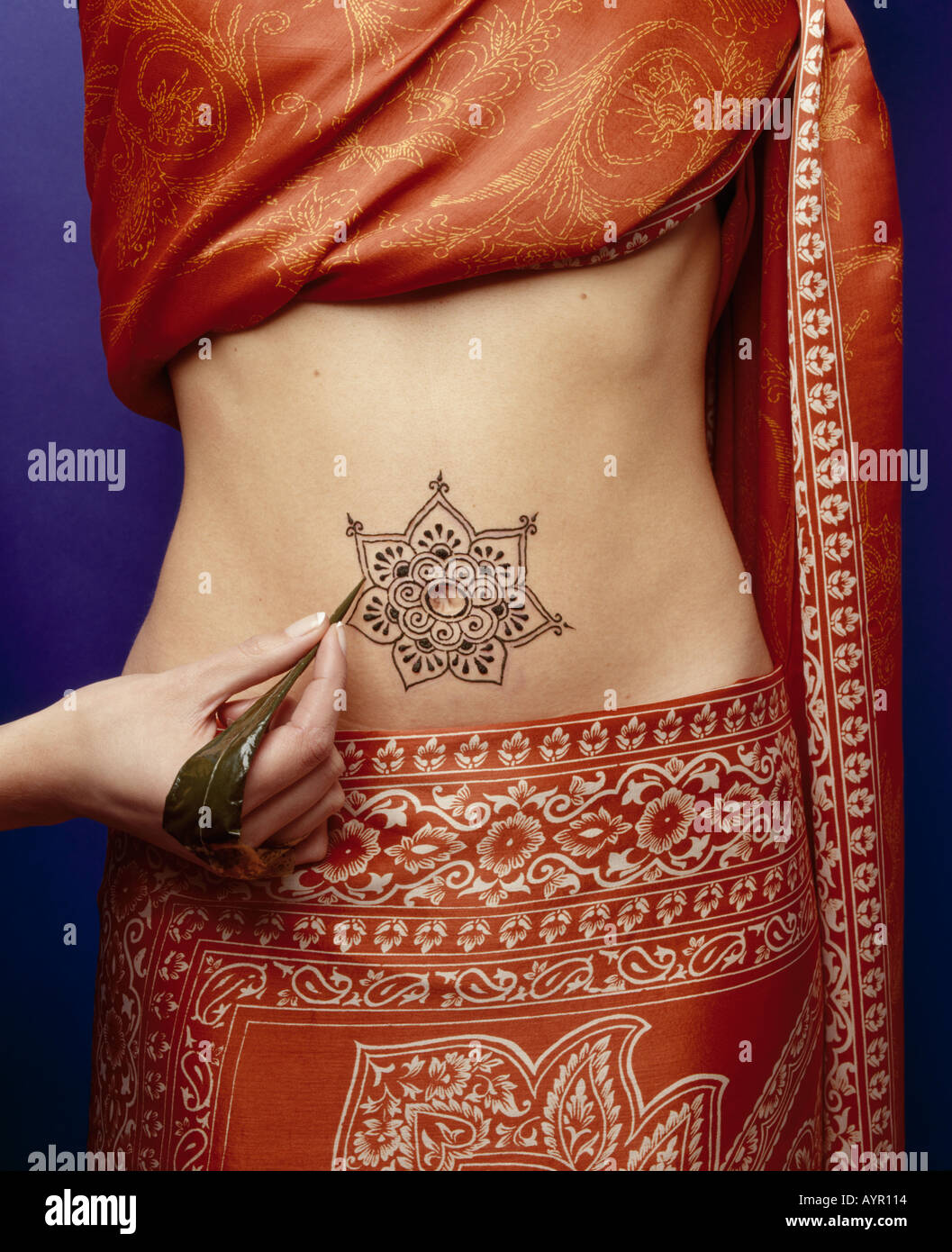 Henna belly button tattoo Stock Photo