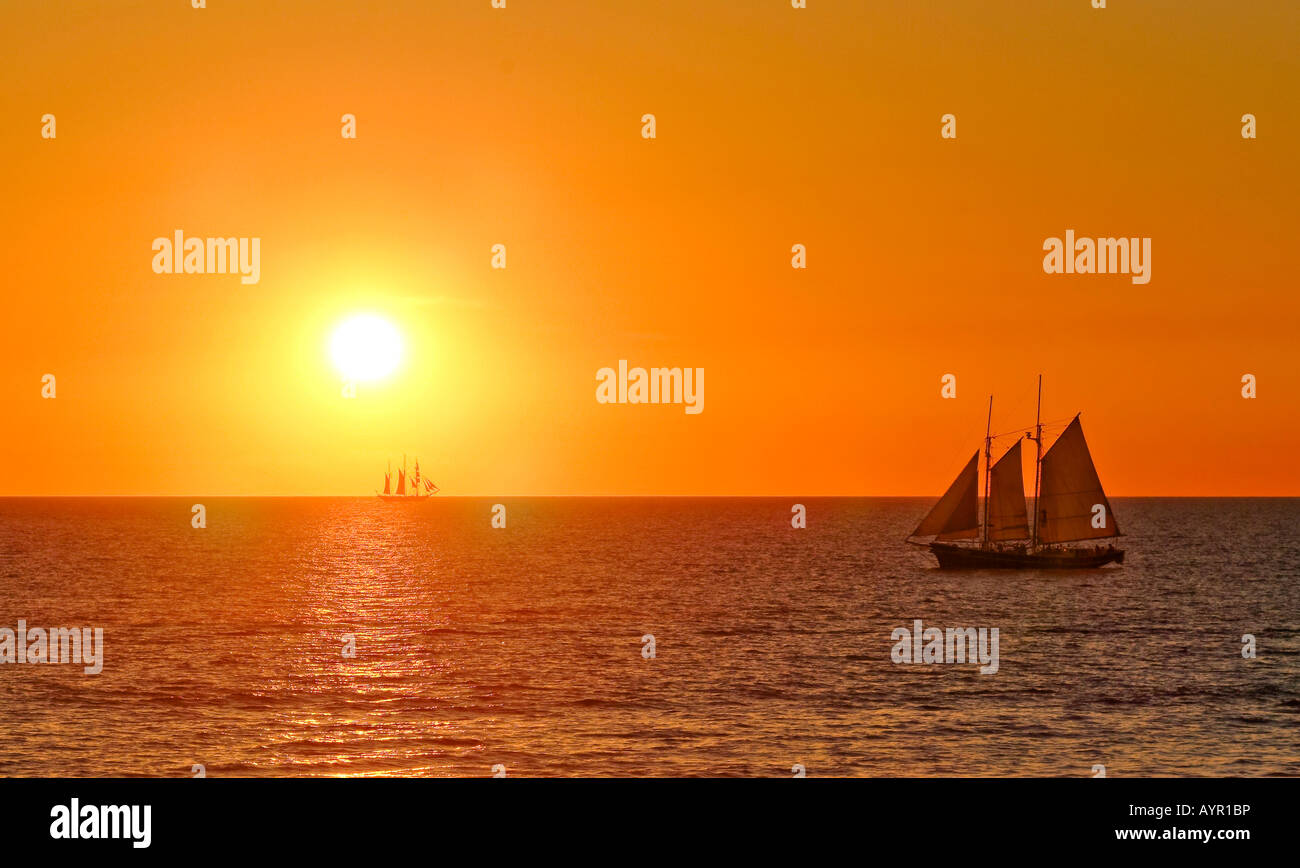 Sailing ships on the ocean at sunset, Broome, Western Australia, Australia Stock Photo