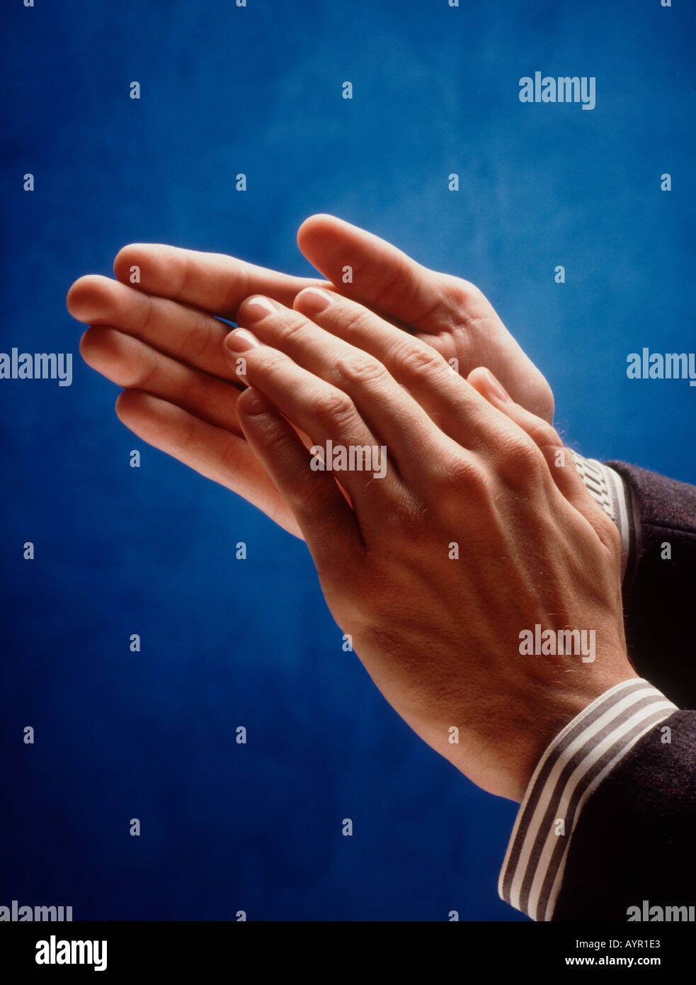 Man's hands clapping. Applause Stock Photo