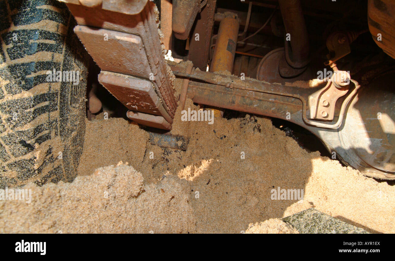 Detail, rear axle of an off-road vehicle (4X4) stuck in the sand Stock Photo