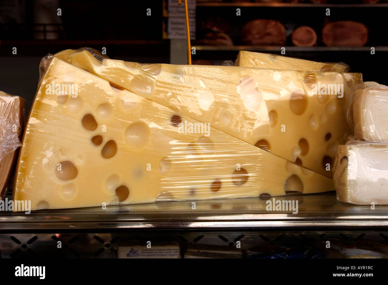 Emmental cheese block on a market stall Stock Photo Alamy