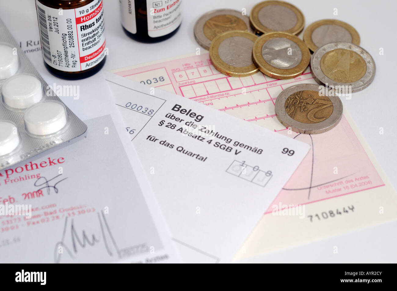 Medication, prescription, receipt and coins Stock Photo