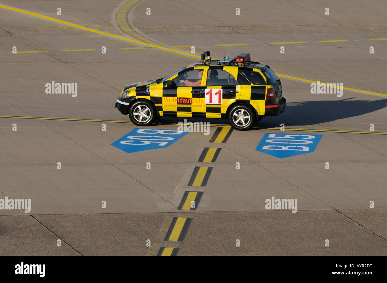 Airport taxiway control vehicle on the taxiway Stock Photo