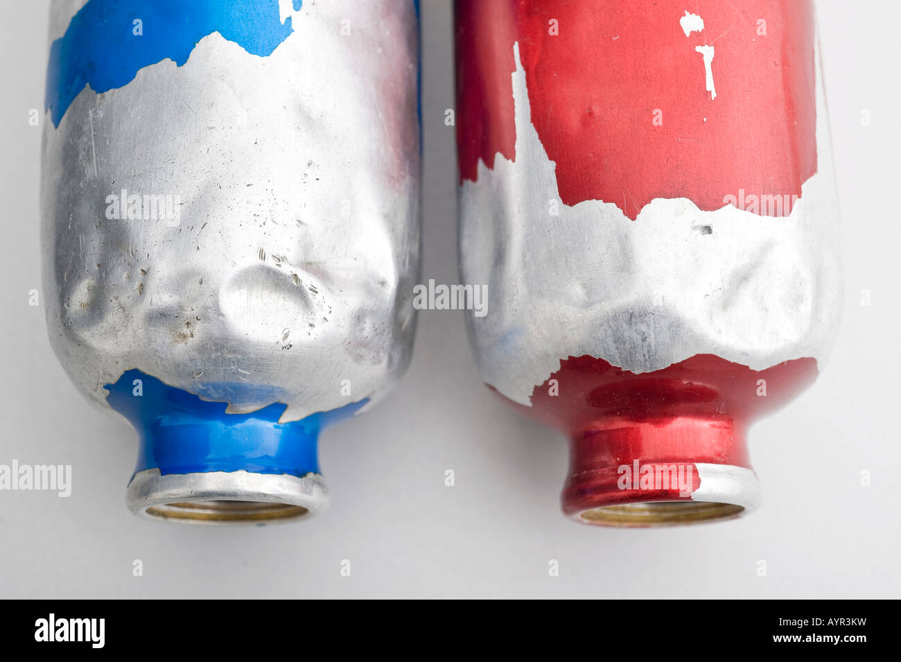 Worn, peeled aluminium bottles Stock Photo