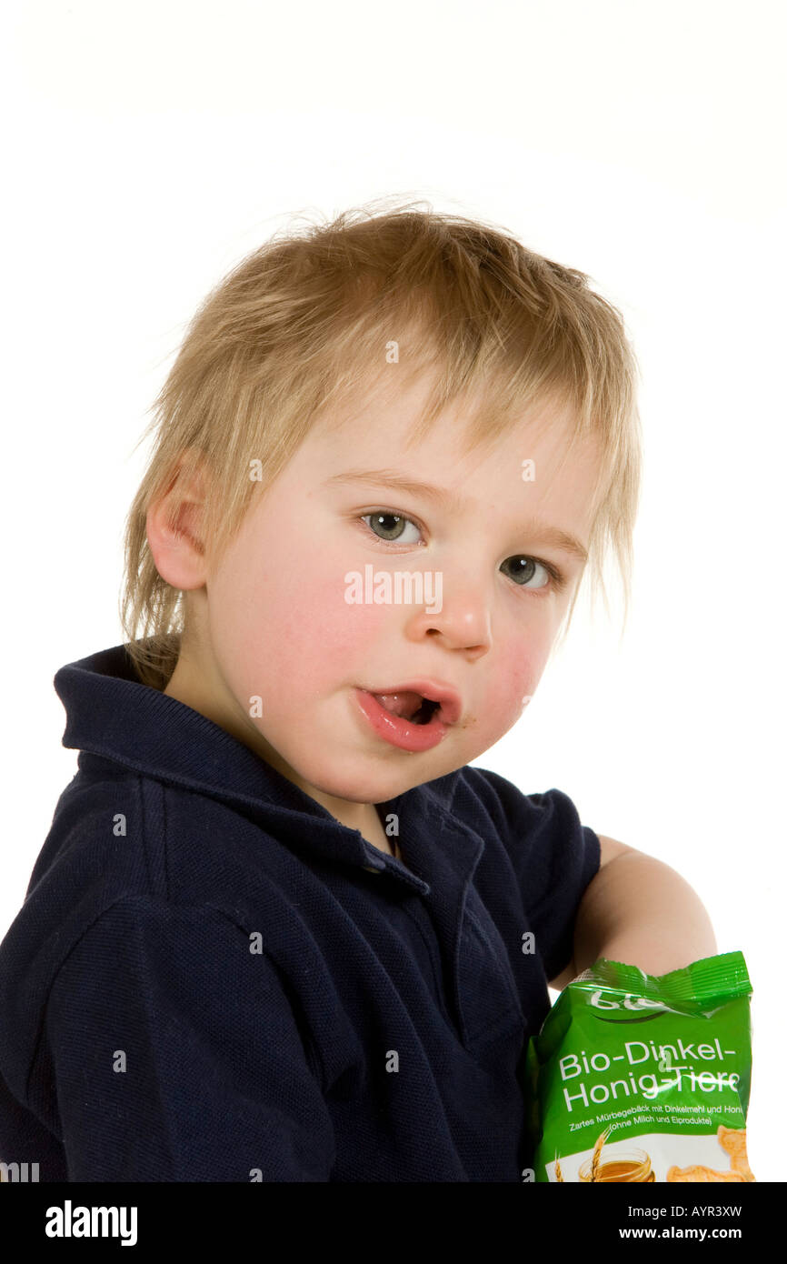 Twoyearold boy eating crackers Stock Photo Alamy