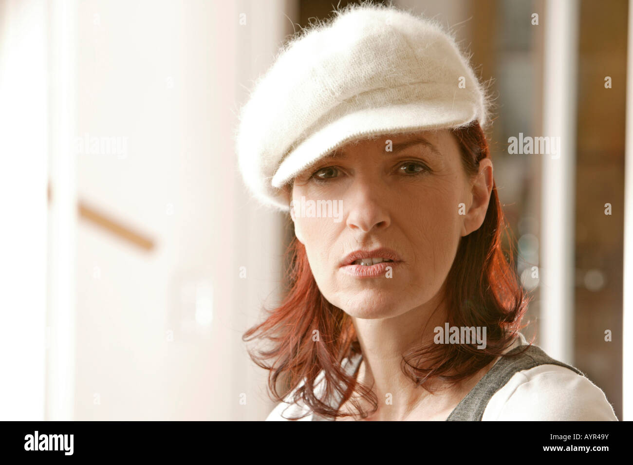 Portrait of a middle-aged woman wearing white hat Stock Photo