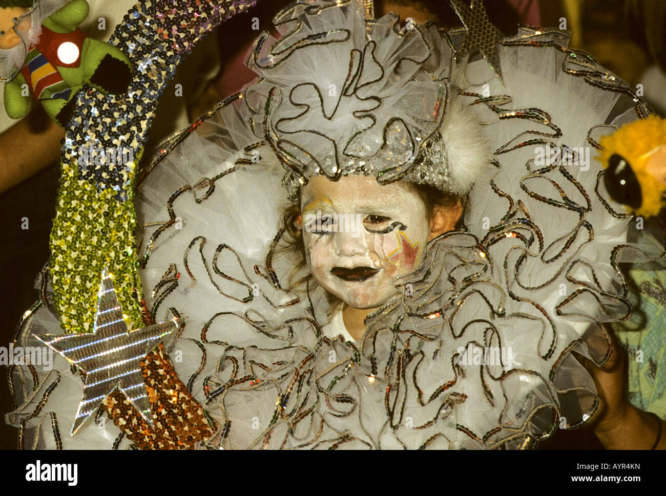 Child queen, crying with make-up smeared by tears during Carnival in Santa Cruz on Tenerife Island, Canary Islands, Spain Stock Photo