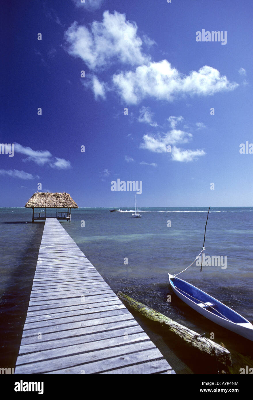Dock beside a small boat on Caye Caulker, Belize, Central America Stock Photo