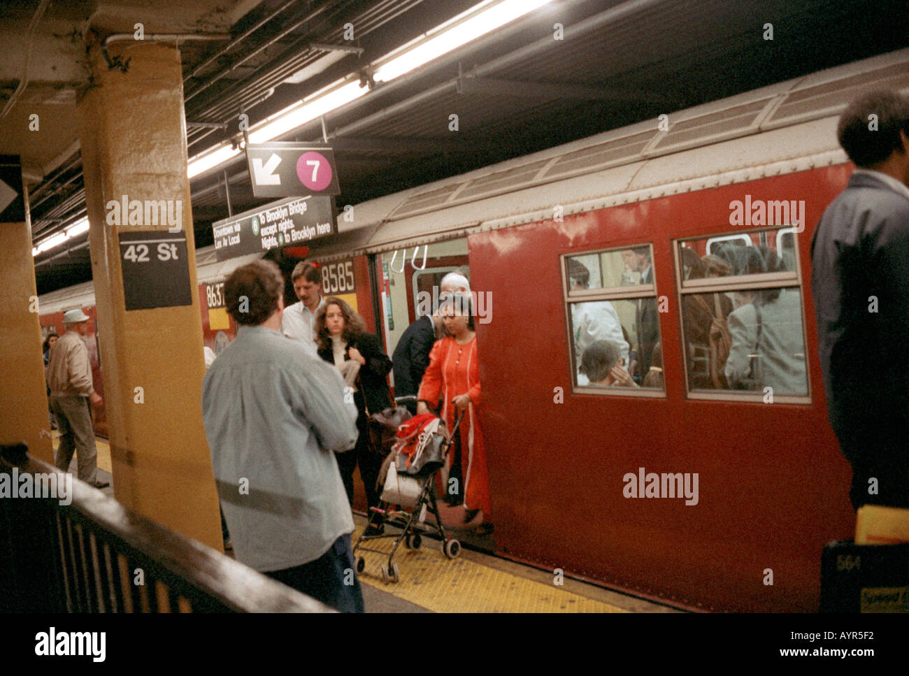 Passengers leave subway train at 42nd Street Grand Central Station