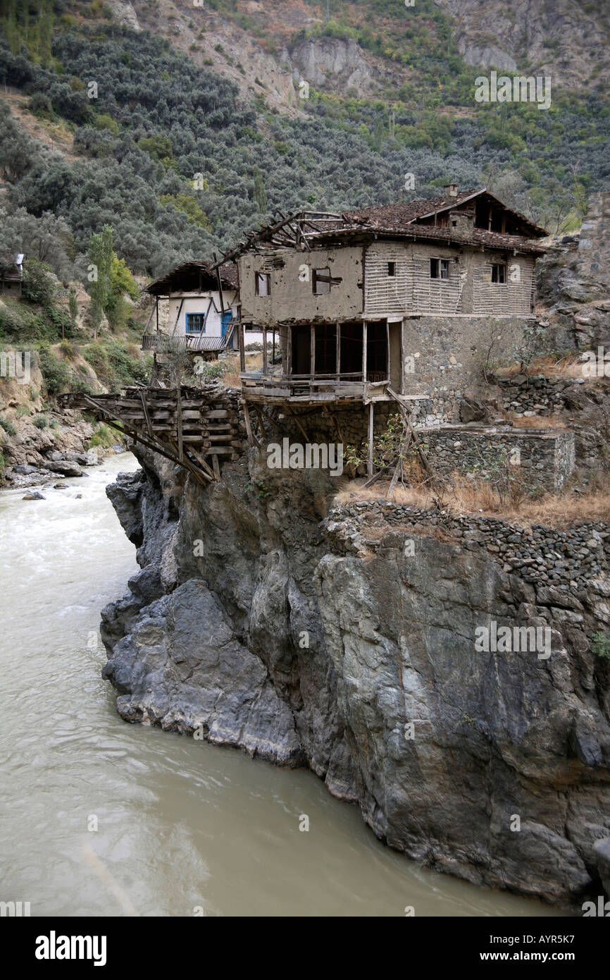 Ramshackle house on edge of river. Black Sea Coast, Turkey Stock Photo